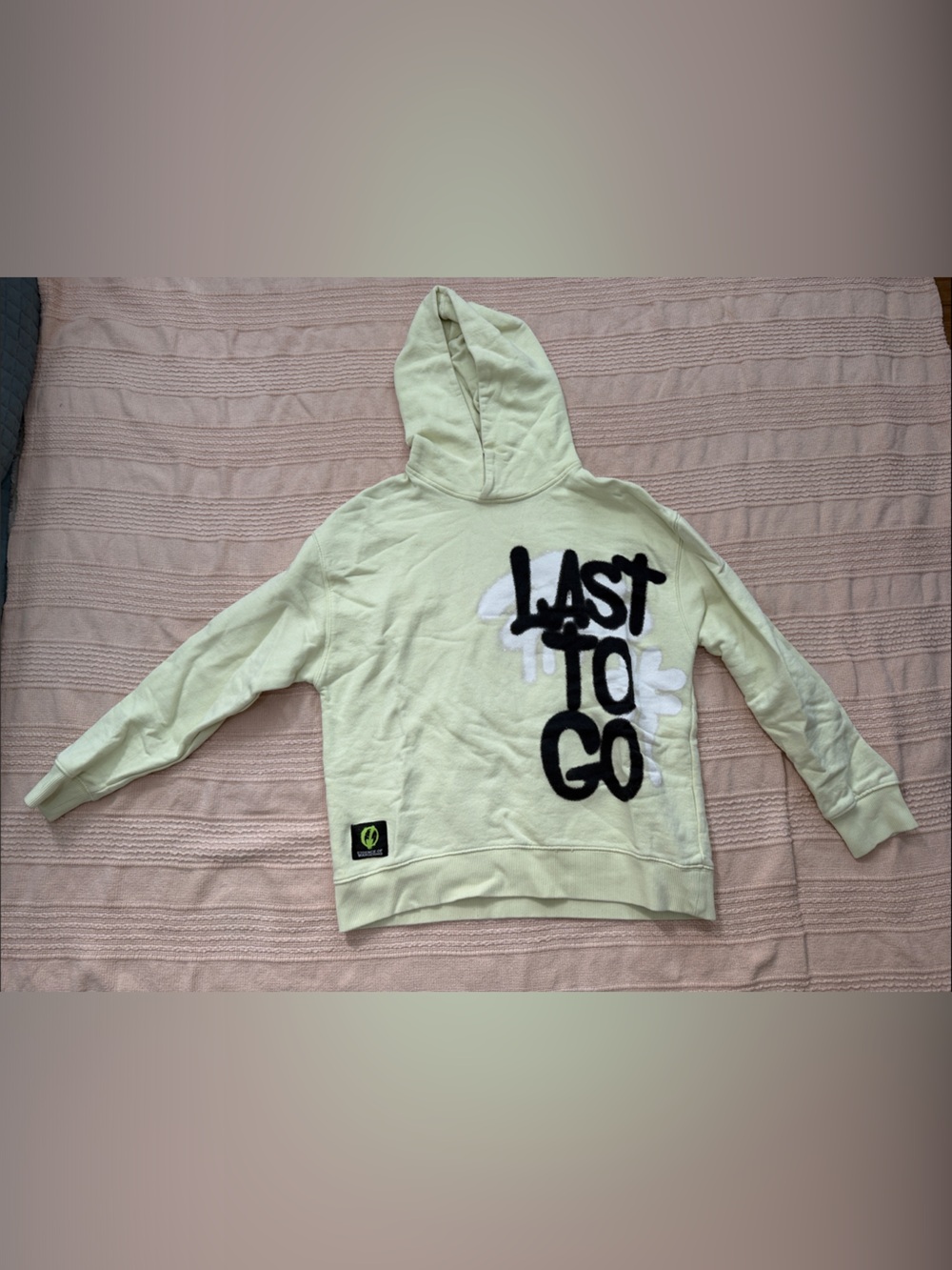 Zara light yellow kids hoodie with black "LAST TO GO" graphic